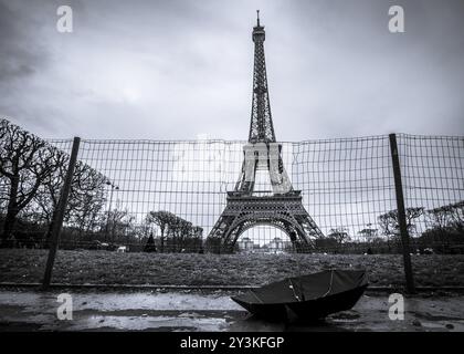 Eiffel tower from Paris, France and a black umbrella, in black and white settings, on a rainy day Stock Photo