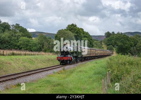 Visiting steam locomotive GWR 6800 Grange Class 6880 Betton Grange approaches Leigh Wood Crossing on the West Somerset Railway Stock Photo