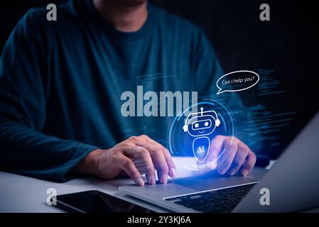 Person interacting with AI chatbot on a laptop, symbolizing advanced digital assistance and customer support. Perfect for technology, IT, and customer Stock Photo
