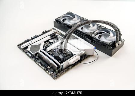 Elegant White Themed Gaming Motherboard Featuring Advanced CPU Liquid Cooling System Design Stock Photo