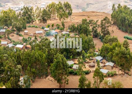 Aerial view to traditional ethiopian local village houses hidden in the wood in Lasla mountains, Lalibela, Amhara Region, Ethiopia. Stock Photo