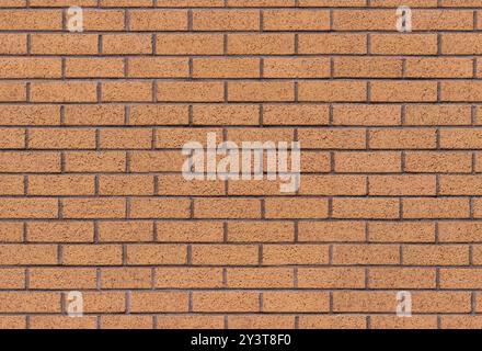 Brown brick wall seamless background texture image. Traditional block masonry surface. A modern interior and exterior and backdrop tile design. Stock Photo