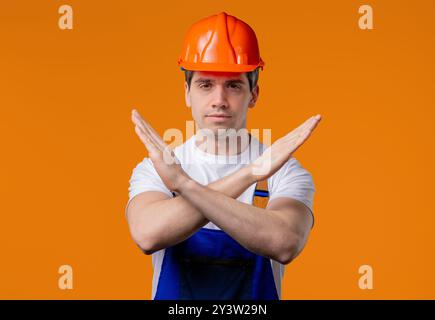No, Never, Mature 30s Worker Builder Man Rejecting Stop Crossing Hands. Ban Stock Photo