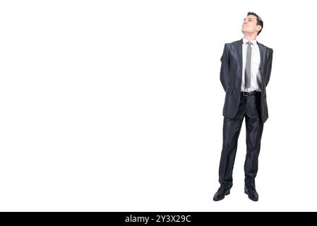 Optimistic businessman in suit in studio. White background. Stock Photo