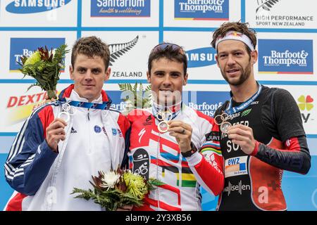 Great Britain’s Jonathan Brownlee, left, silver medal, with Spain’s Javier Gomez, winner of the Elite Men's Race of the World Triathlon Grand Final and bronze medal winner Switzerland’s Sven Riederer, Auckland, New Zealand, Sunday, October 21, 2012. Stock Photo