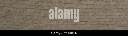 Earthy beige woven veneer surface with a tactile embossed texture Stock Photo