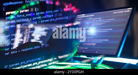 Work from home. Programmer coding code on notebook screen at Stock Photo