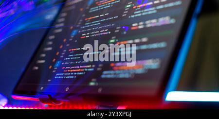 Modern tech. PHP syntax highlighted. Writing programming functions on laptop. Stock Photo