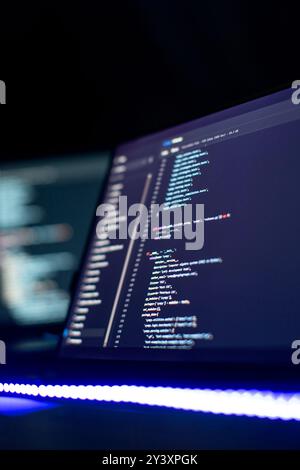 Modern tech. PHP syntax highlighted. Writing programming functions on laptop. Stock Photo