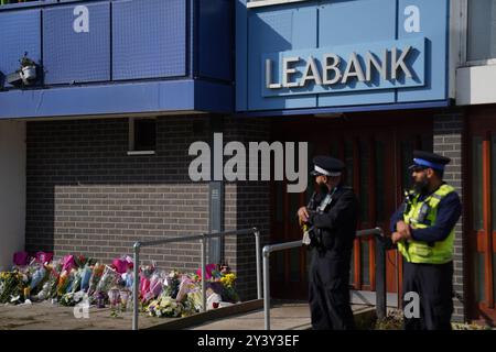 Police officers at Leabank in Luton, Bedfordshire, where three people, believed to be Juliana Prosper, 48, Kyle Prosper, 16, and Giselle Prosper, 13, although formal identification has yet to take place, were found dead in a flat in Leabank, off Wauluds Bank Drive, at around 5.30am on Friday. Nicholas Prosper, 18, of Leabank, Luton, has been charged with the murders of the woman and the two teenagers Bedfordshire Police said. Picture date: Sunday September 15, 2024. Stock Photo