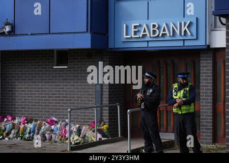 Police officers at Leabank in Luton, Bedfordshire, where three people, believed to be Juliana Prosper, 48, Kyle Prosper, 16, and Giselle Prosper, 13, although formal identification has yet to take place, were found dead in a flat in Leabank, off Wauluds Bank Drive, at around 5.30am on Friday. Nicholas Prosper, 18, of Leabank, Luton, has been charged with the murders of the woman and the two teenagers Bedfordshire Police said. Picture date: Sunday September 15, 2024. Stock Photo