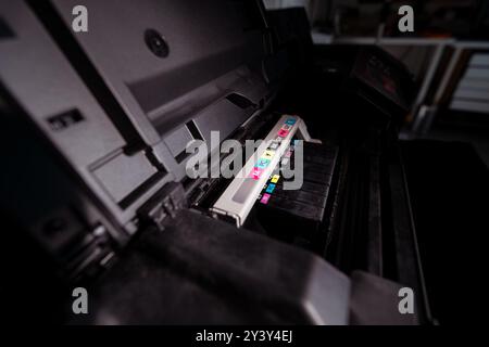 Professional inkjet printer. Ink cartridges. Printing studio. Stock Photo