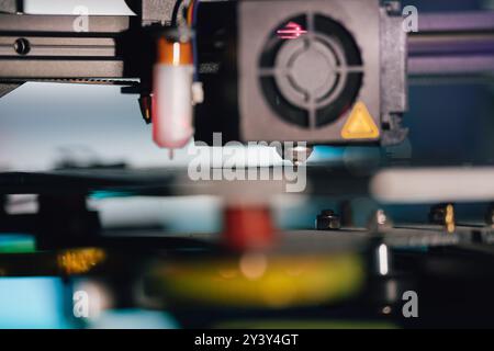 3D printer. Home studio lab factory. Close-up nozzle arm. Stock Photo