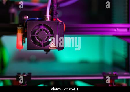 3D printer. Home studio lab factory. Close-up nozzle arm. Stock Photo