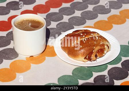 Traditional Korvapuusti, cinnamon bun and coffee, Helsinki Stock Photo