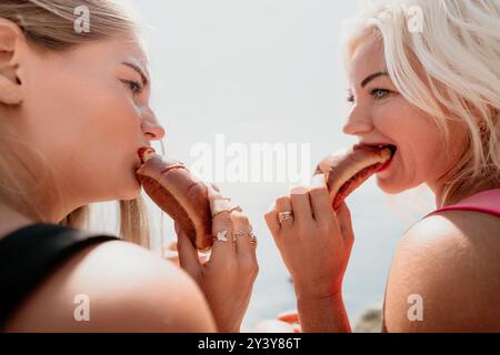 Two Women Enjoying a Delicious Meal Together Stock Photo