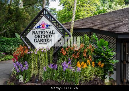 A large sign, ‘National Orchid Garden’ at the main entrance to the orchid gardens within the Botanic Gardens within the 165-year-old tropical garden, Stock Photo