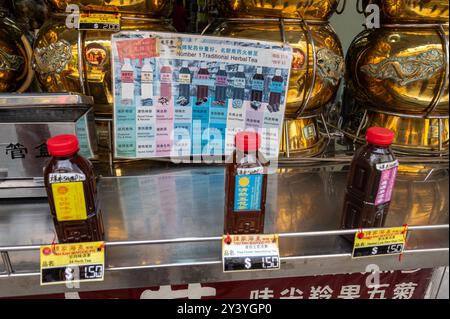 A shop display of bottled Chinese herbal medicines on sale in Smith Street, Chinatown, an old historic Chinese quarter in Singapore.  Much of the old Stock Photo