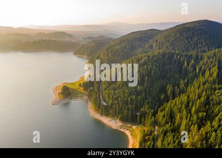 Scenic view of the mountains and the lake in the fog, Bulgaria. Mountain lakes surrounded by forests, aerial shot using a drone Stock Photo