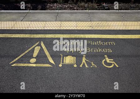 Warning notice on the platform at Carlisle Citadel station. Stock Photo