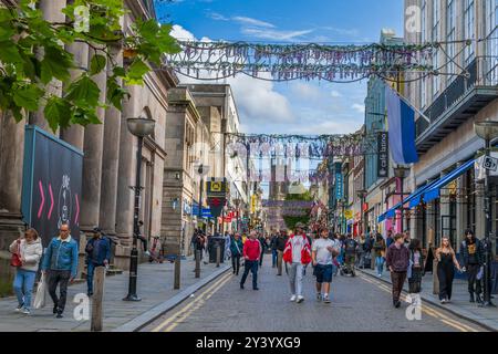 Bold street Liverpool once known as the Bond street of the north with St. Lukes the bombed out church at the far end. The former gentlemans club the L Stock Photo