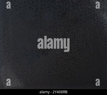 Pattern of black spotted plastic texture background close up view Stock Photo