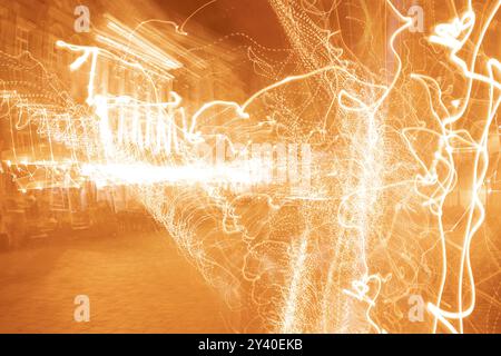 Vivid, tangled streaks of light. Poznan, old town - Market Square city night blurred lights, abstract collage. Stock Photo