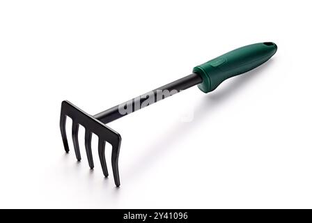 Small garden rake or trowel isolated on white background. Gardening tools. Stock Photo