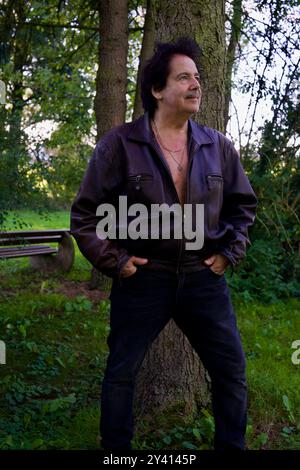 Good looking man in a dark leather jacket Stock Photo