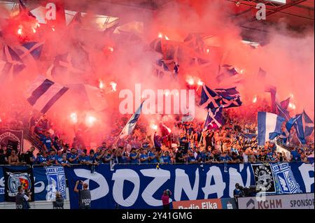 LUBIN, POLAND - AUGUST 17, 2024: Football match Polish PKO Ekstraklasa between KGHM Zaglebie Lubin vs Lech Poznan. Supporters of Lech burn flares. Stock Photo