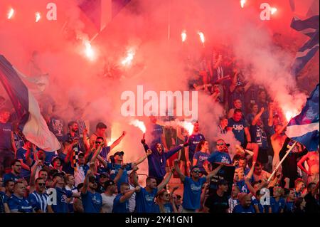 LUBIN, POLAND - AUGUST 17, 2024: Football match Polish PKO Ekstraklasa between KGHM Zaglebie Lubin vs Lech Poznan. Supporters of Lech burn flares. Stock Photo