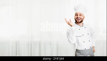 Chef Man Gesturing With Hand Approving Recipe Standing In Kitchen Stock Photo