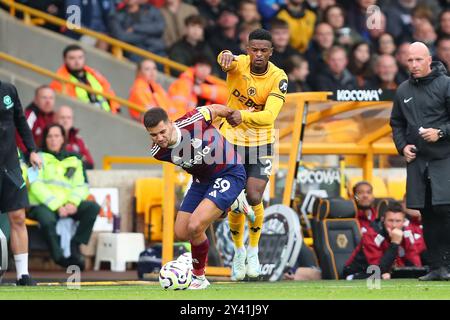 Wolverhampton, UK. 14th Sep, 2024. Bruno Guimar‹es of Newcastle (L) and Nlson Semedo of Wolves during the Premier League match between Wolverhampton Wanderers and Newcastle United Credit: MI News & Sport /Alamy Live News Stock Photo