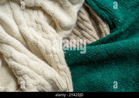 Two hand knitted wool sweaters. Background textures. Stock Photo