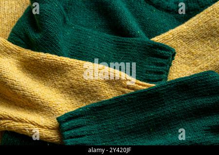 Two hand knitted wool sweaters. Background textures Stock Photo