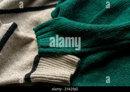Two hand knitted wool sweaters. Background textures Stock Photo