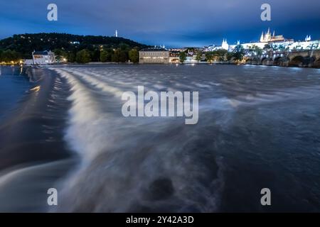 Prague, Czech Republic. 15th Sep, 2024. Waves seen at Vltava river during the rising water level in Prague with overview of historical part of the city including Prague Castle and Charles bridge. Heavy rains during the recent days have caused water levels to rise in Vltava river, which caused flood emergency warning. Floods caused by heavy rains have been battering region of central and eastern Europe, including Czech Republic, Poland, Austria, Slovakia and Romania since 13 September 2024. (Photo by Tomas Tkacik/SOPA Images/Sipa USA) Credit: Sipa USA/Alamy Live News Stock Photo