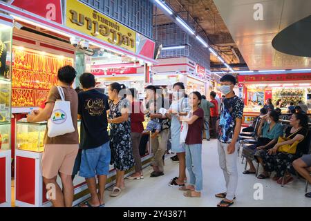 Crowds gather at gold jewelry shops, stalls at the Talat Sao Morning Market complex in Vientiane, Laos. Stock Photo