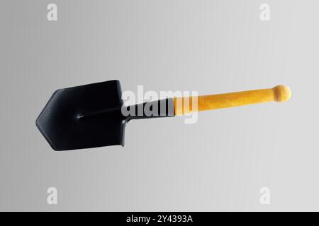 Black sapper blade. Close-up. Isolated on a gray background. Stock Photo