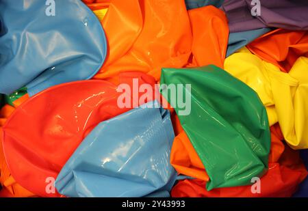 A range of multi colored individual swimming caps. Stretchy rubber latex racing swim caps to keep the hair dry and improve speed Stock Photo