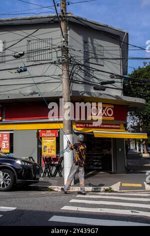 Sao Paulo, Brazil, March 15 2023. Front view of Oxxo supermarket in Sao Paulo city. Oxxo is popular Mexican chain of grocery stores or convenience sto Stock Photo