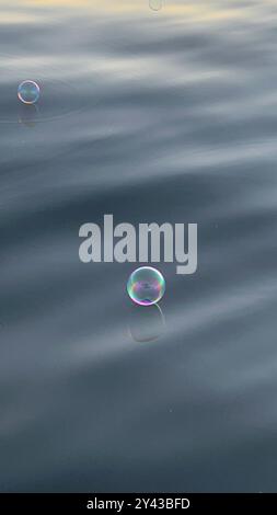 SOAP BUBBLES ON WATER Stock Photo
