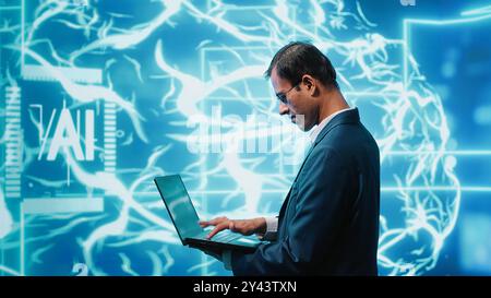 Computer scientist solving tasks on laptop, running artificial intelligence programming scripts. Engineer manipulating lines of code for AI applications development, camera A Stock Photo