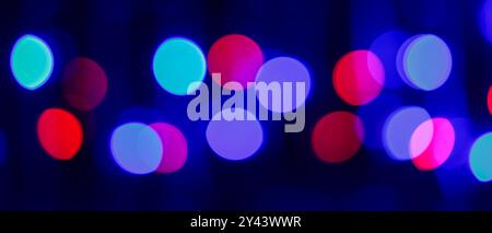 Vibrant Multi-Colored Bokeh Lights Creating Abstract Nightlife Background with Defocused Circular Patterns Stock Photo