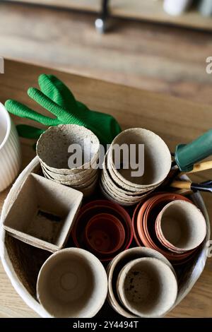 Collection of clay pots placed on table. Stock Photo