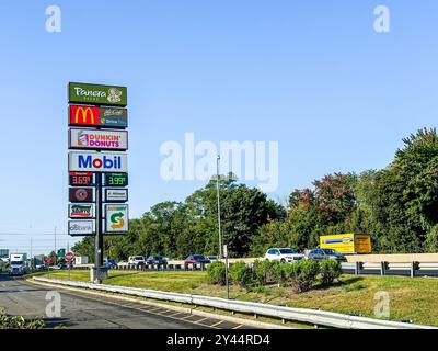 NORWALK, CT, USA- SEPTEMBER 13, 2024: Fast food signs and gas station at Darien North travel plaza on I 95 Stock Photo