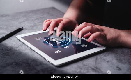 Woman use VPN Virtual Private Network protocol on digital tablet. VPN concept.1 Stock Photo