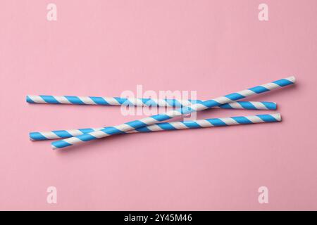 Bamboo drinking straws on pink background, top view Stock Photo