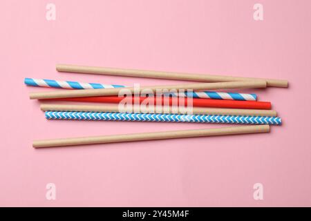 Bamboo drinking straws on pink background, top view Stock Photo