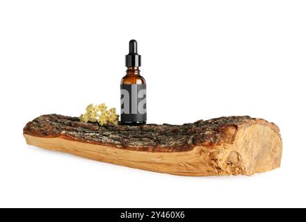 Tincture in bottle, flowers and wooden snag on white background Stock Photo